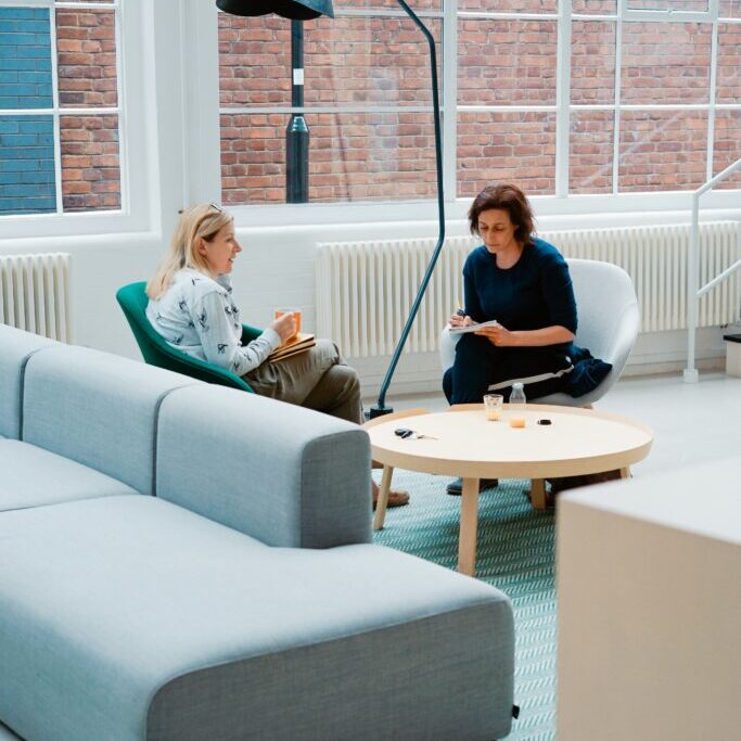 Two people having a meeting in an open plan area